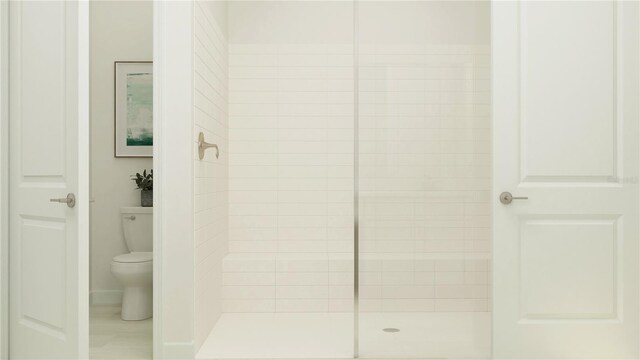 12054 Violet Jasper Dr, Parrish, FL 34219 - bathroom with toilet and a tile shower