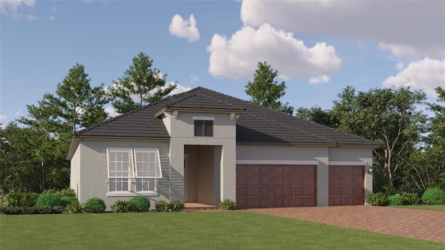 12062 Violet Jasper Dr, Parrish, FL 34219 - view of front facade with a tiled roof, a front yard, a garage, decorative driveway, and stucco siding
