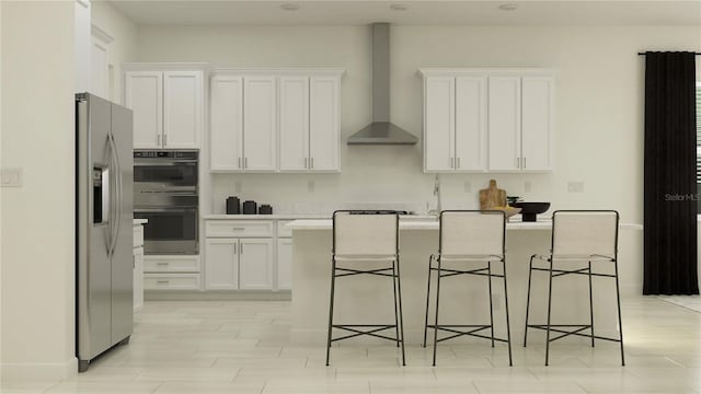 12062 Violet Jasper Dr, Parrish, FL 34219 - kitchen with wall chimney range hood, a kitchen island with sink, a breakfast bar area, appliances with stainless steel finishes, and white cabinetry