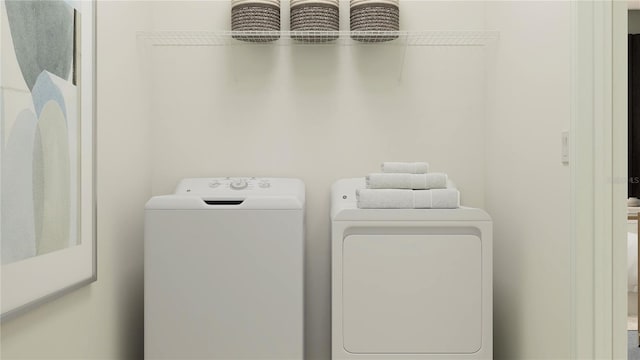 12062 Violet Jasper Dr, Parrish, FL 34219 - laundry room featuring laundry area and washing machine and clothes dryer