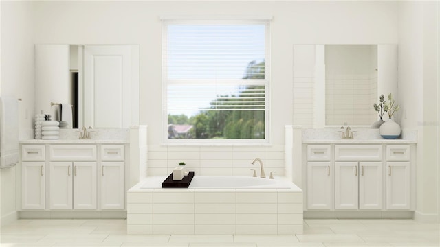 12062 Violet Jasper Dr, Parrish, FL 34219 - bathroom featuring two vanities, a healthy amount of sunlight, a sink, and a bath