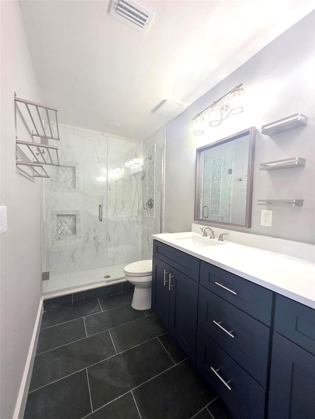 bathroom with toilet, vanity, a marble finish shower, visible vents, and tile patterned floors