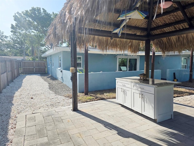 view of patio / terrace with a gazebo, area for grilling, and a fenced backyard