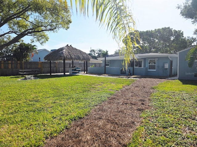 view of yard with fence and a gazebo