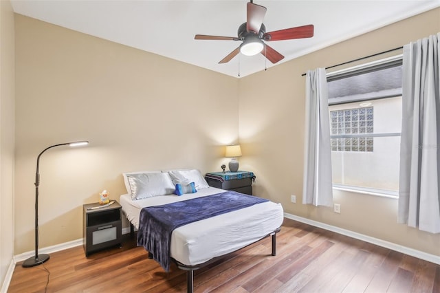 20254 Ravens End Dr, Tampa, FL 33647 - bedroom with baseboards, ceiling fan, and wood finished floors