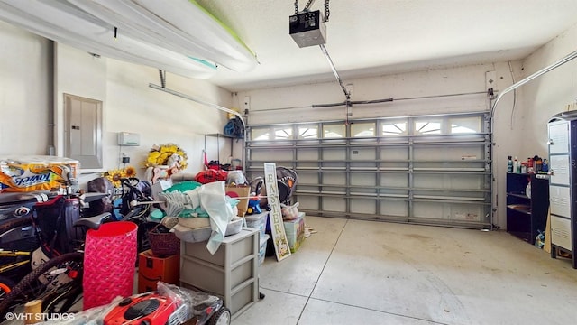 garage featuring a garage door opener and electric panel