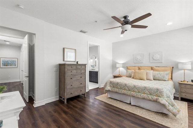 bedroom with visible vents, wood finished floors, baseboards, recessed lighting, and ensuite bath