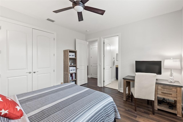 bedroom with visible vents, a closet, wood finished floors, baseboards, and ceiling fan