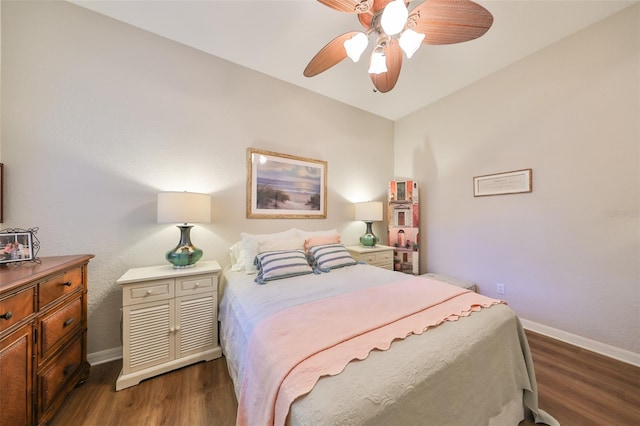 bedroom featuring baseboards, ceiling fan, and wood finished floors