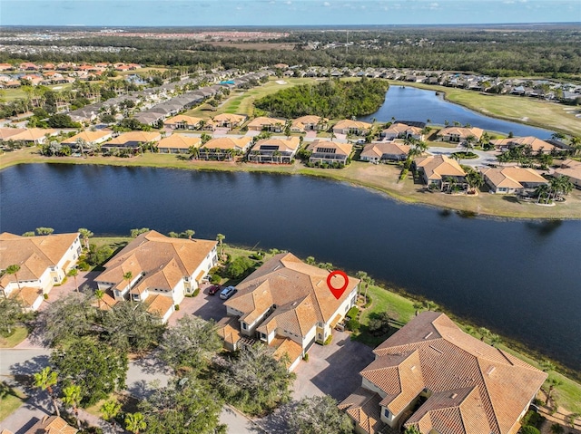 aerial view featuring a residential view and a water view