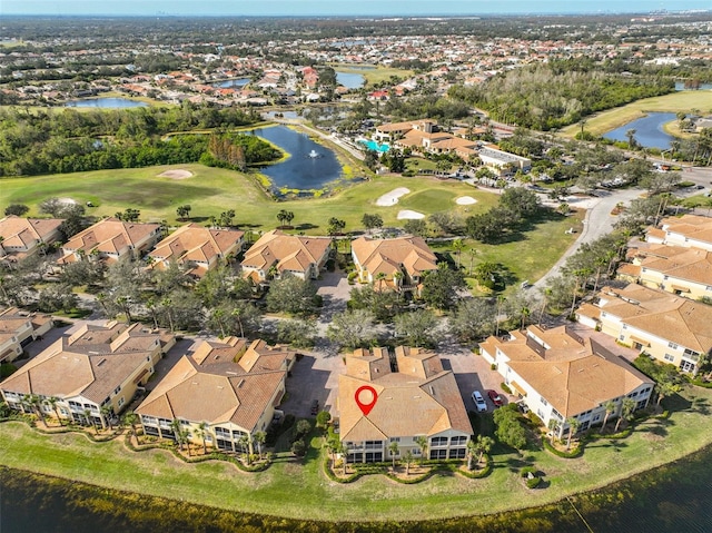 aerial view featuring a water view, a residential view, and golf course view