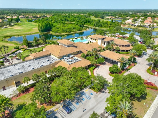 aerial view featuring a water view, view of golf course, and a residential view