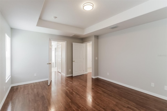 2203 Malaga Ave, Spring Hill, FL 34609 - unfurnished bedroom with wood finished floors and baseboards