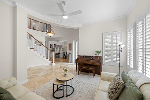 living room featuring stairs, a ceiling fan, baseboards, and ornamental molding