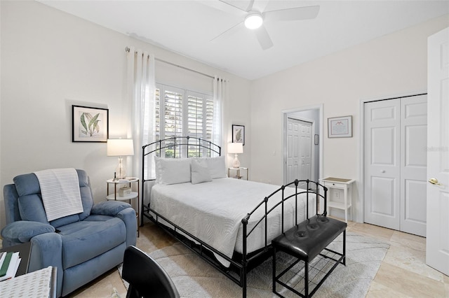 bedroom featuring a ceiling fan and multiple closets