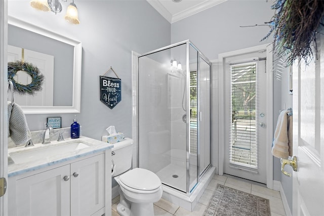 bathroom with tile patterned flooring, ornamental molding, a stall shower, and toilet