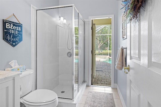 full bathroom featuring baseboards, tile patterned floors, a stall shower, and toilet