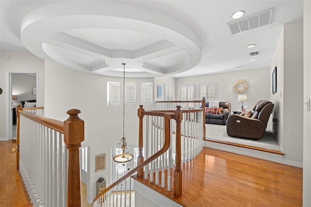 corridor with recessed lighting, baseboards, an upstairs landing, light wood-type flooring, and visible vents