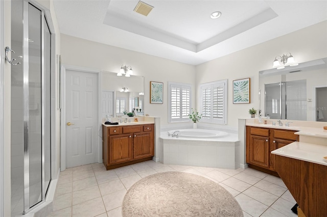 full bath featuring visible vents, tile patterned flooring, a bath, a shower stall, and a sink