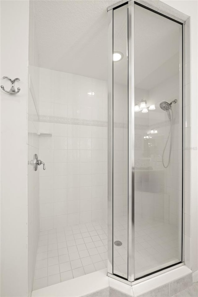 bathroom with a shower stall