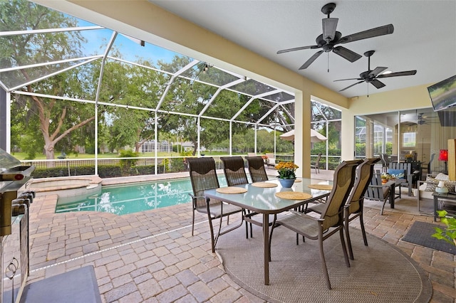 outdoor pool featuring a ceiling fan, a hot tub, a patio area, and glass enclosure