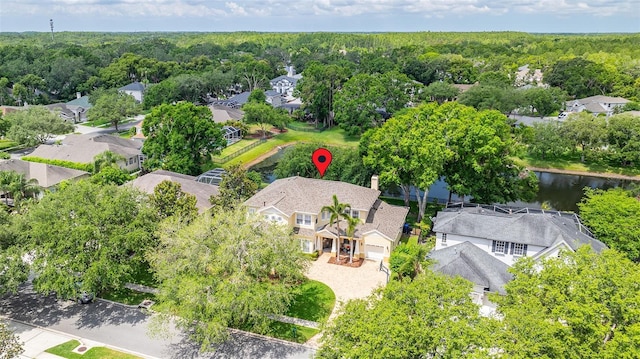 drone / aerial view featuring a water view and a residential view