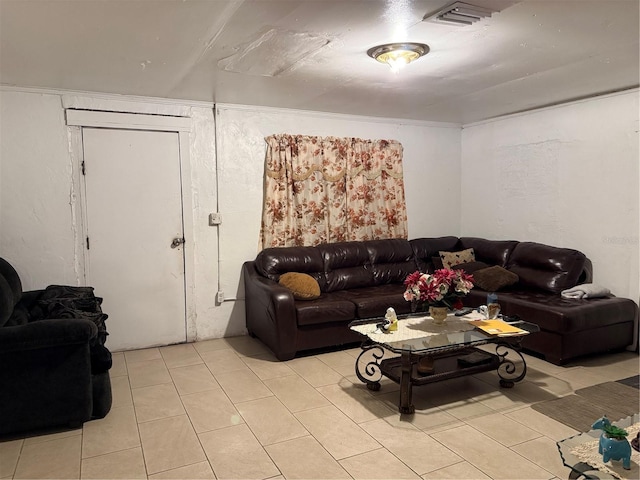 living area with light tile patterned floors and visible vents