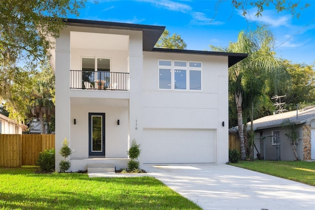 116 W Stanley St, Tampa, FL 33604 - view of front facade with a balcony, driveway, stucco siding, and an attached garage