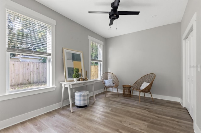 116 W Stanley St, Tampa, FL 33604 - living area featuring wood finished floors, baseboards, and ceiling fan