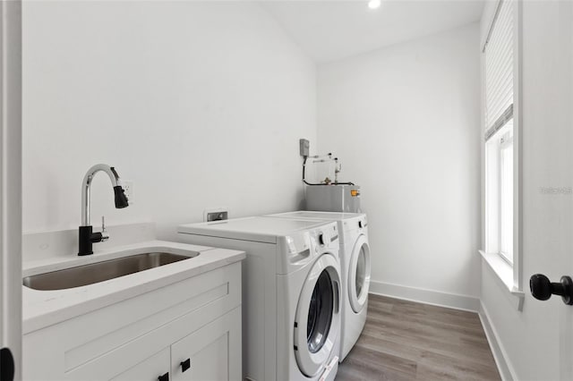 116 W Stanley St, Tampa, FL 33604 - washroom with washer and dryer, healthy amount of natural light, electric water heater, baseboards, and recessed lighting