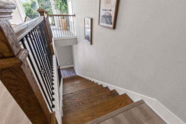 116 W Stanley St, Tampa, FL 33604 - staircase with baseboards and wood finished floors
