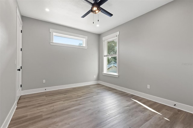 116 W Stanley St, Tampa, FL 33604 - empty room featuring ceiling fan, wood finished floors, baseboards, and recessed lighting