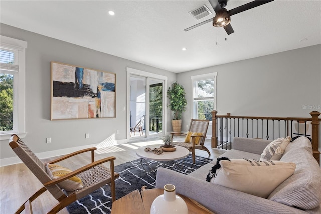 116 W Stanley St, Tampa, FL 33604 - living room with wood finished floors, ceiling fan, recessed lighting, and baseboards