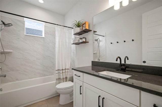 full bathroom with vanity, toilet, tile patterned floors, and shower / tub combo
