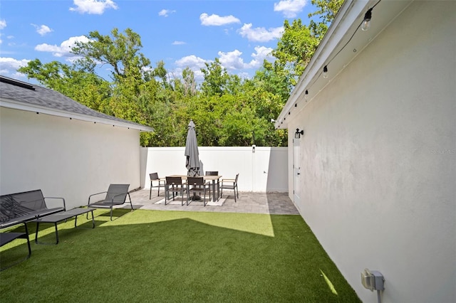 view of yard with fence and a patio area
