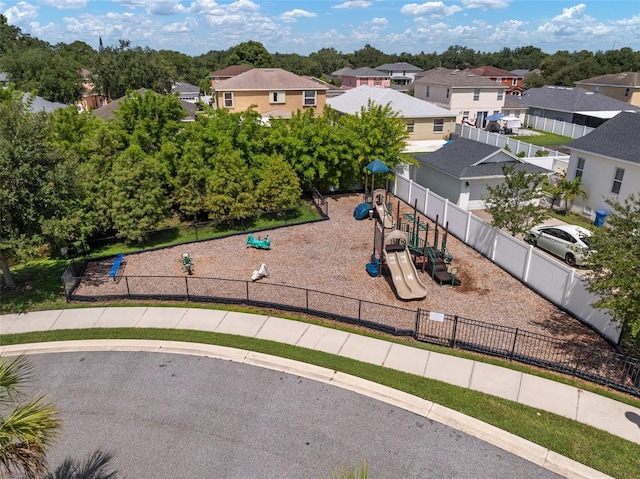 community jungle gym with fence and a residential view