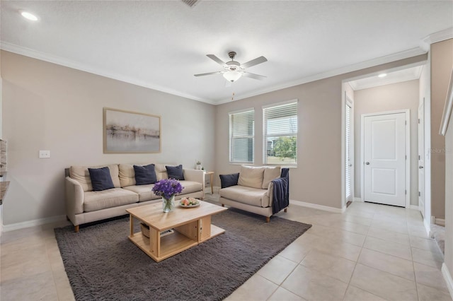 living area featuring crown molding, a ceiling fan, baseboards, and light tile patterned floors