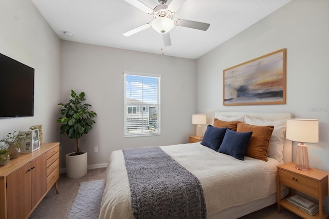 bedroom featuring baseboards, ceiling fan, and carpet flooring