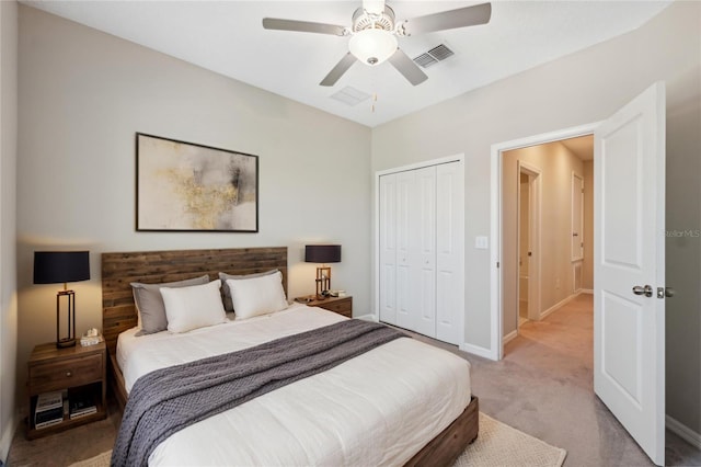 31970 Blue Passing Loop, Wesley Chapel, FL 33545 - carpeted bedroom featuring a closet, ceiling fan, and baseboards