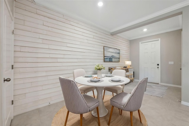 31970 Blue Passing Loop, Wesley Chapel, FL 33545 - dining area with crown molding, light tile patterned flooring, wood walls, baseboards, and beamed ceiling