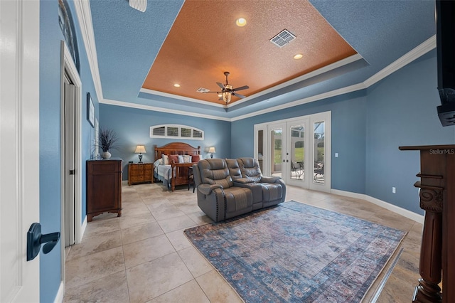 bedroom with french doors, a textured ceiling, access to exterior, visible vents, and a raised ceiling
