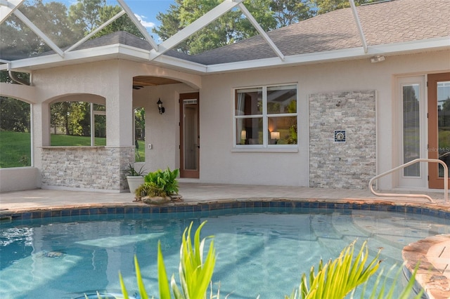 outdoor pool featuring a patio and a lanai