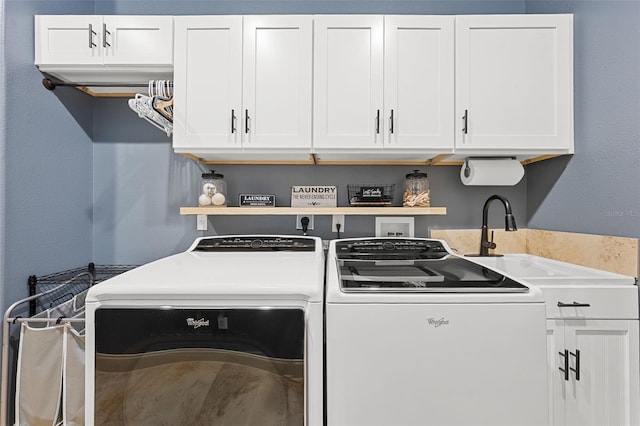 washroom featuring cabinet space and washer and dryer