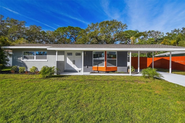 2042 Craft Ln, Sarasota, FL 34239 - single story home with fence, stucco siding, concrete driveway, and a front lawn