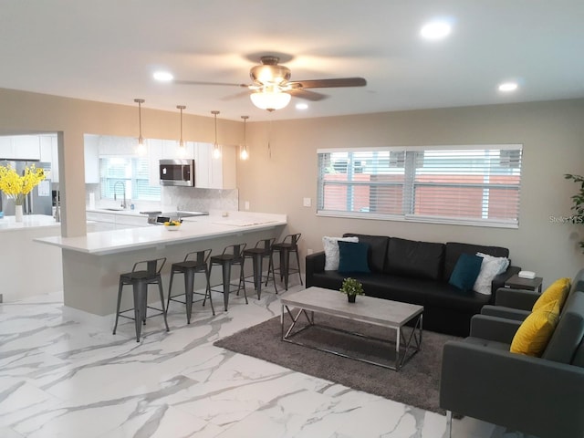 2042 Craft Ln, Sarasota, FL 34239 - living room featuring recessed lighting, marble finish floor, plenty of natural light, and ceiling fan