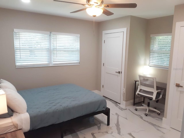 2042 Craft Ln, Sarasota, FL 34239 - bedroom featuring multiple windows, a ceiling fan, and marble finish floor