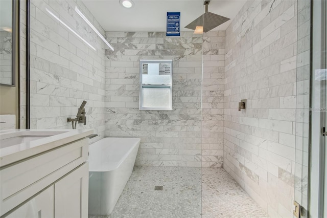 2042 Craft Ln, Sarasota, FL 34239 - full bathroom with a freestanding bath, vanity, walk in shower, and recessed lighting