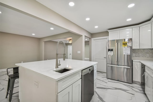 2042 Craft Ln, Sarasota, FL 34239 - kitchen with stainless steel appliances, recessed lighting, a sink, and marble finish floor