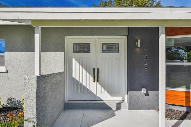 2042 Craft Ln, Sarasota, FL 34239 - doorway to property with stucco siding
