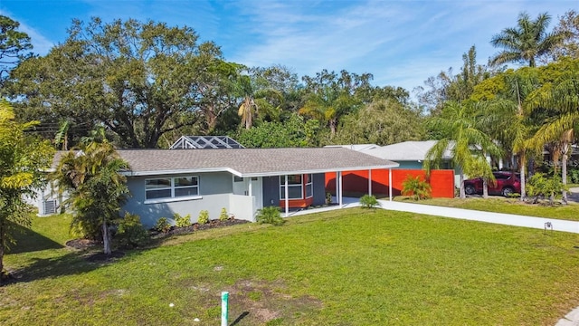 2042 Craft Ln, Sarasota, FL 34239 - ranch-style house with concrete driveway, stucco siding, a front lawn, and an attached carport